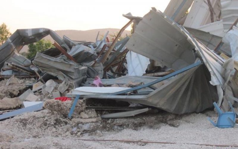 Demolishing a commercial structure in Sabastiya