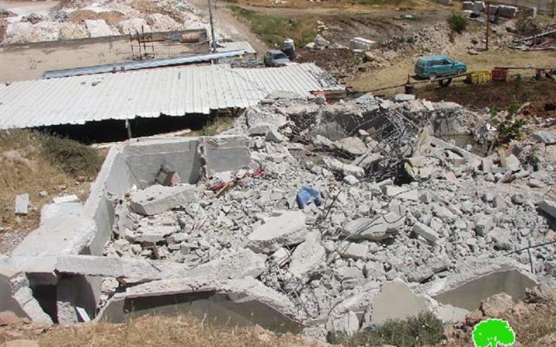 The Israeli occupation demolishes a house and water cistern in Hebron