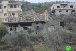 The Israeli Occupation Forces notify two Nablus residences of stop-work