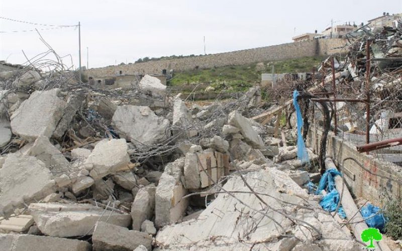 Israeli occupation bulldozers demolish under construction building in the Jerusalem town of At-Tur