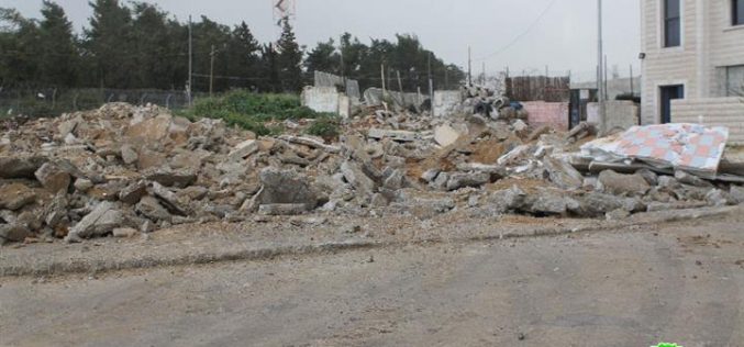 Dozers of Israeli Occupation Forces demolish commercial and residential structures in the Jerusalem town of Beit Hanina