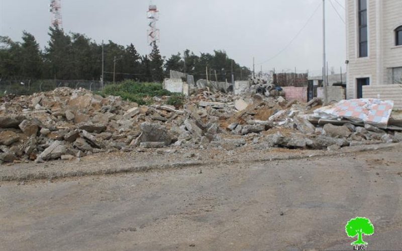 Dozers of Israeli Occupation Forces demolish commercial and residential structures in the Jerusalem town of Beit Hanina