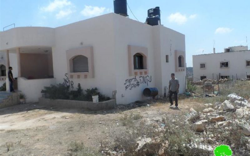 A car torched and hatred-enticing slogans written on walls