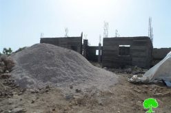 Stop-work order on a residence in al-Dairat village-Yatta