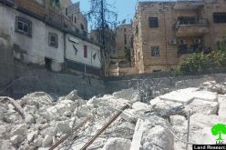 The Israeli occupation municipality demolishes a three story building in the Jerusalem neighborhood of Wad Al-Juz