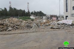 Dozers of Israeli Occupation Forces demolish commercial and residential structures in the Jerusalem town of Beit Hanina