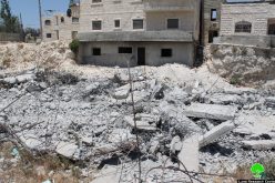 Dozers of Israeli municipality in Jerusalem demolish a house in the Al-Isawiya town