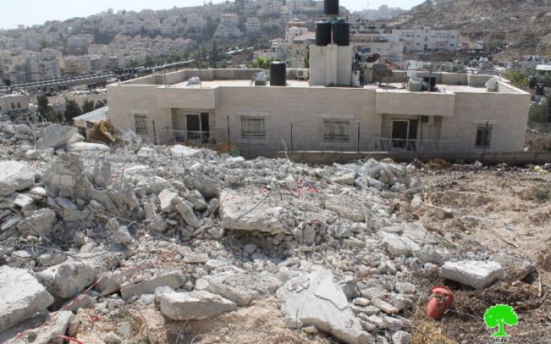Demolishing an under construction building in the neighborhood of Beit Hanina north of Jerusalem