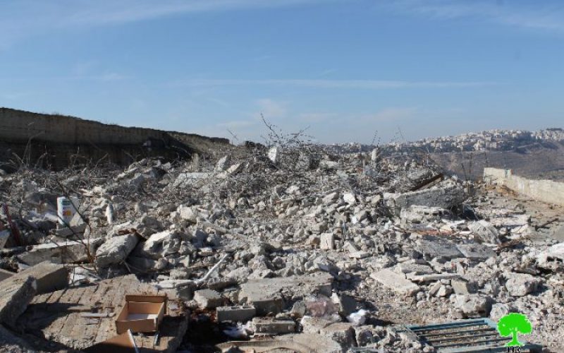 Dozers of Israel Municipality demolish a residential building in Shuafat, north of Jerusalem