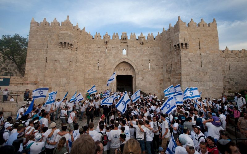 Israeli colonists march in Jerusalem to celebrate the fiftieth anniversary of occupation