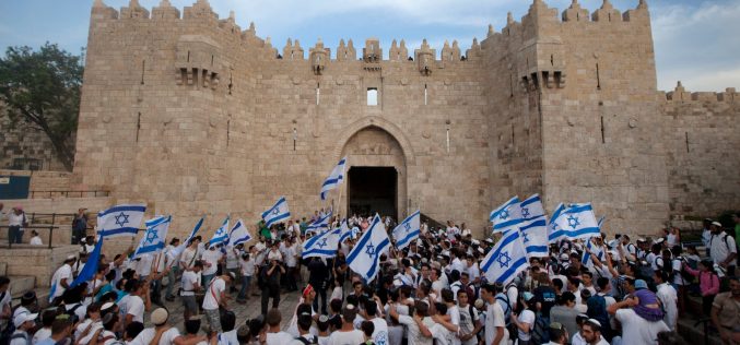 Israeli colonists march in Jerusalem to celebrate the fiftieth anniversary of occupation