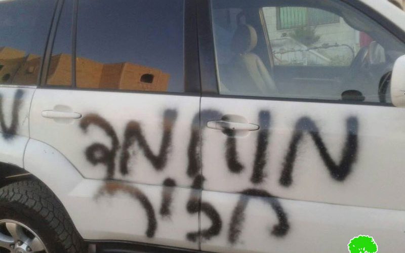 Fanatic Israeli colonist slash tires of Jerusalemite cars and write  insults against Prophet Mohammad (PBUH) in Shu’fat village in Jerusalem