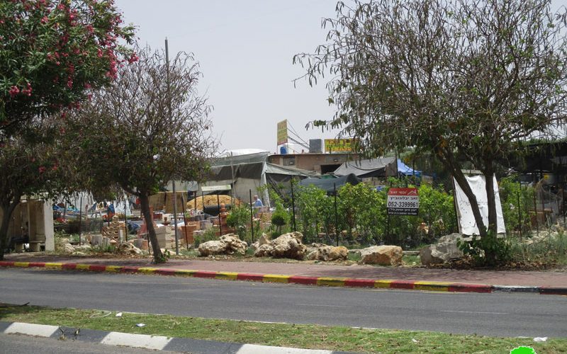 The Israeli occupation forces serve a demolishing order on a plants nursery in An-Nabi Elyas village / Qalqilya governorate