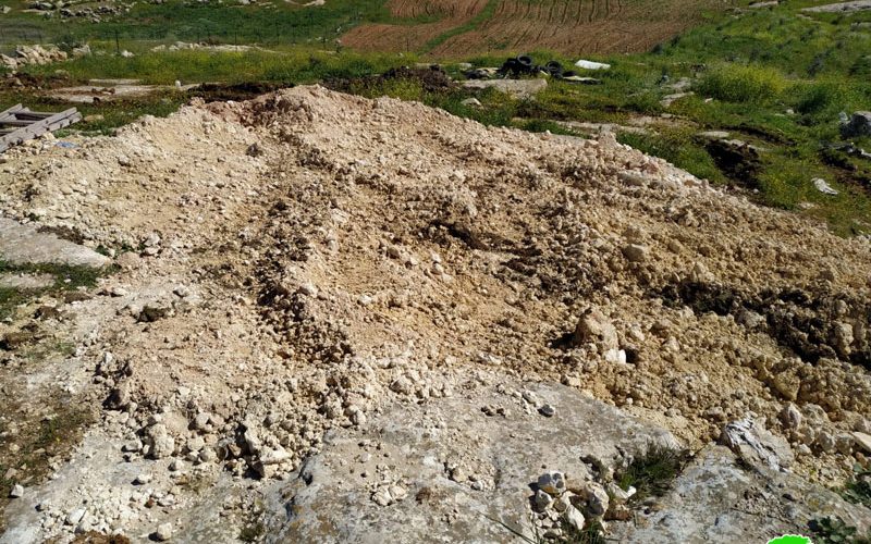 The occupation force a farmer to dump a cistern in “Umm Near” south Yatta / Hebron Governorate