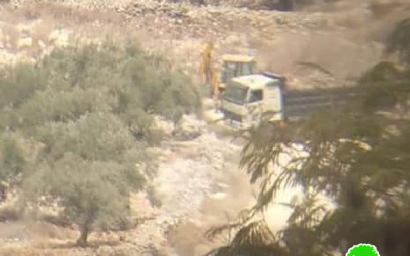 Confiscating a bulldozer and a truck in Kafr Qadoum village/ Qalqilya governorate