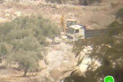 Confiscating a bulldozer and a truck in Kafr Qadoum village/ Qalqilya governorate