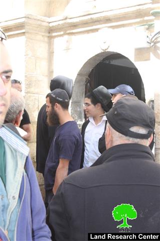 Colonists poke holes in the walls of Sub laban residence in the Old City of Jerusalem
