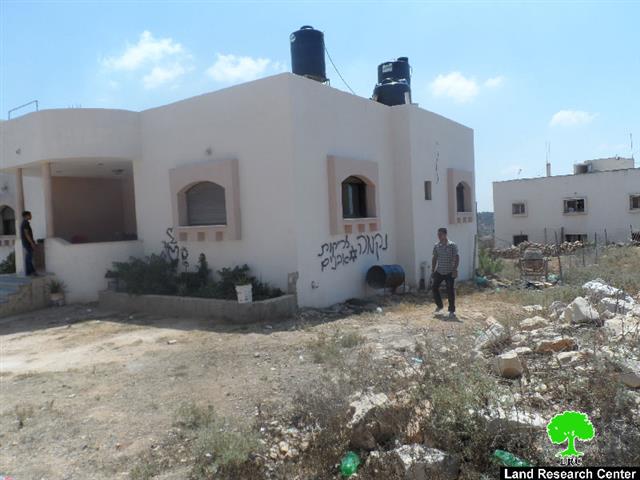 A car torched and hatred-enticing slogans written on walls