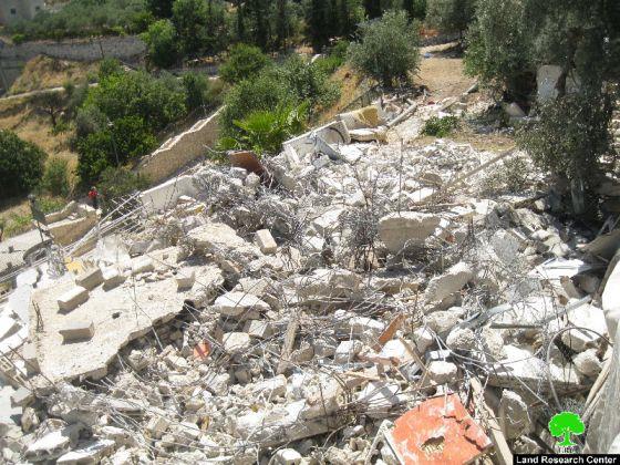 Israeli dozers demolish a residence in Al Mukabber