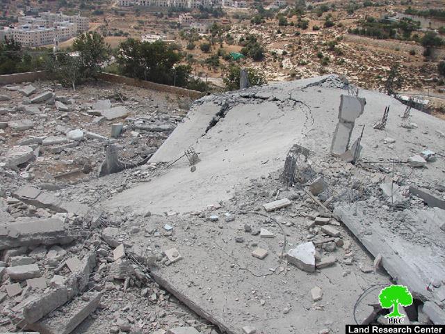 The Israeli occupation blows up two houses and seals off another house with concrete