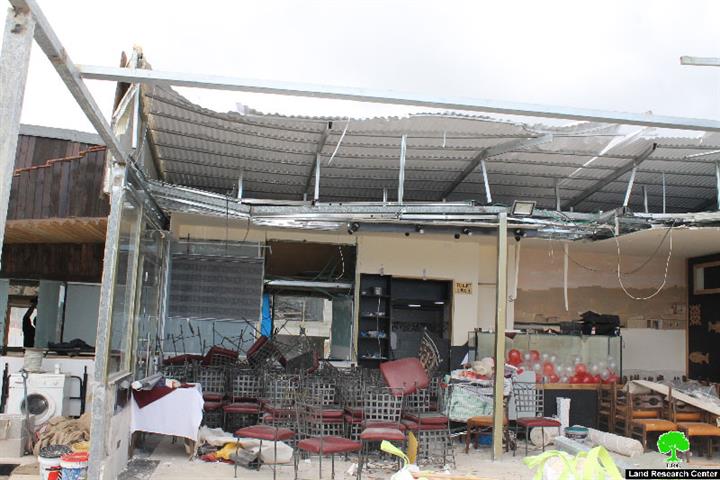 The Israeli Occupation dozers demolish part of a restaurant in Jerusalem