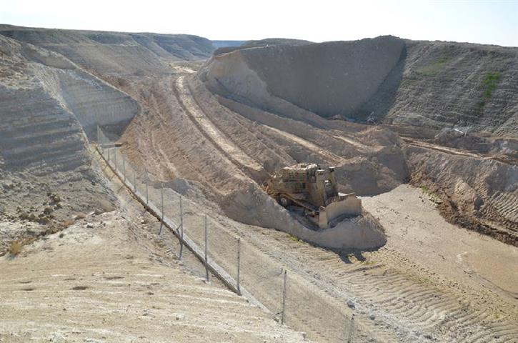 Demolishing a rainwater-catchment pool in Jericho