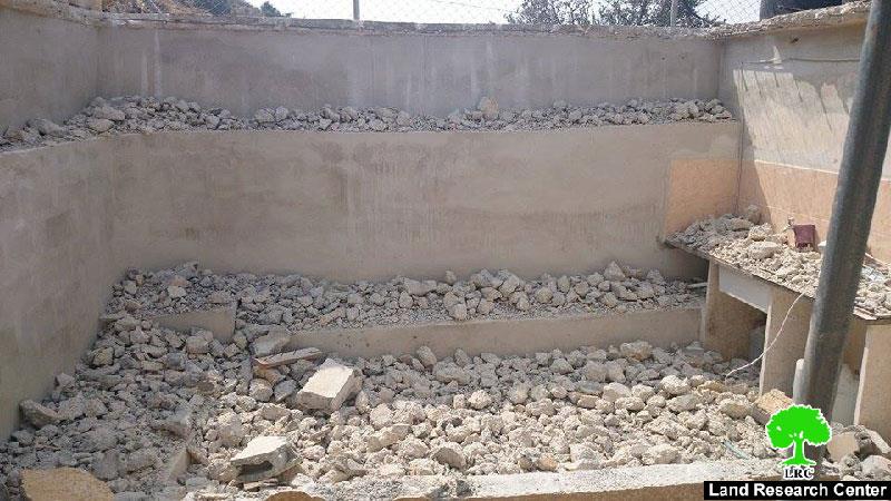 Self-demolition: A crime against humanity 
The Israeli occupation forces a Palestinian to self-demolish his agricultural room in the Hebron village of Beit Kahil