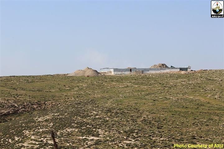 Israeli settlers construct a new bypass road on lands of Kisan village
