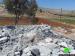 Demolishing a mosque and a number of agricultural and residential structures in Khirbet al Taweel