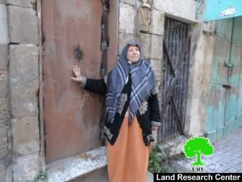 Israeli forces weld shut the doors of an elderly Palestinian woman’s house on Shuhada Street