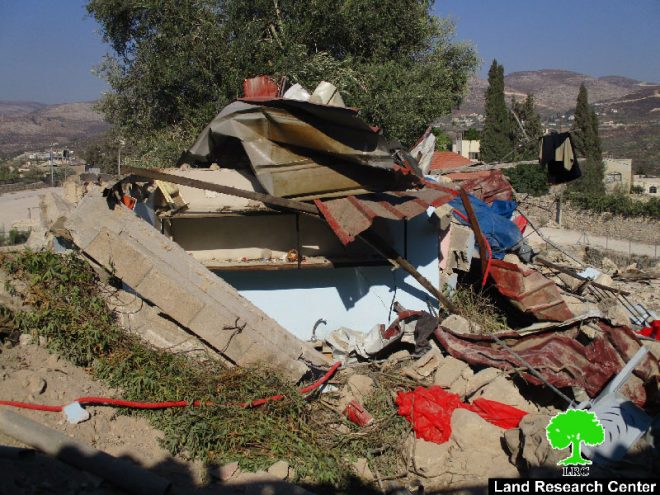 Israeli Occupation Forces demolish structures, impose self-demolition on a barrack in Nablus