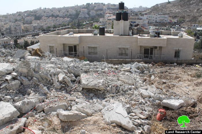 Demolishing an under construction building in the neighborhood of Beit Hanina north of Jerusalem
