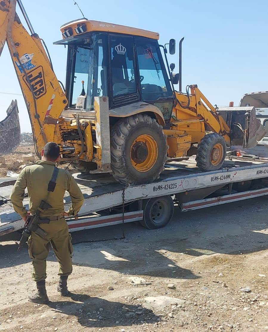 The Occupation Forces confiscated an excavator in Ad-Dirat village east Yatta / Hebron Governorate
